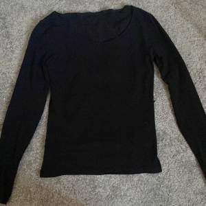 A regular black shirt, long sleeves, U ring,only used a couple times, good condition 