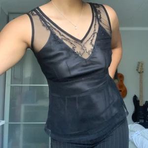 Svart Topp - Cool topp i meshtyg i storlek XS.