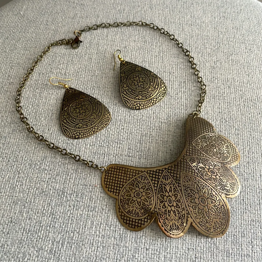 It’s made of Brass Earrings  Necklace . Accessoarer.