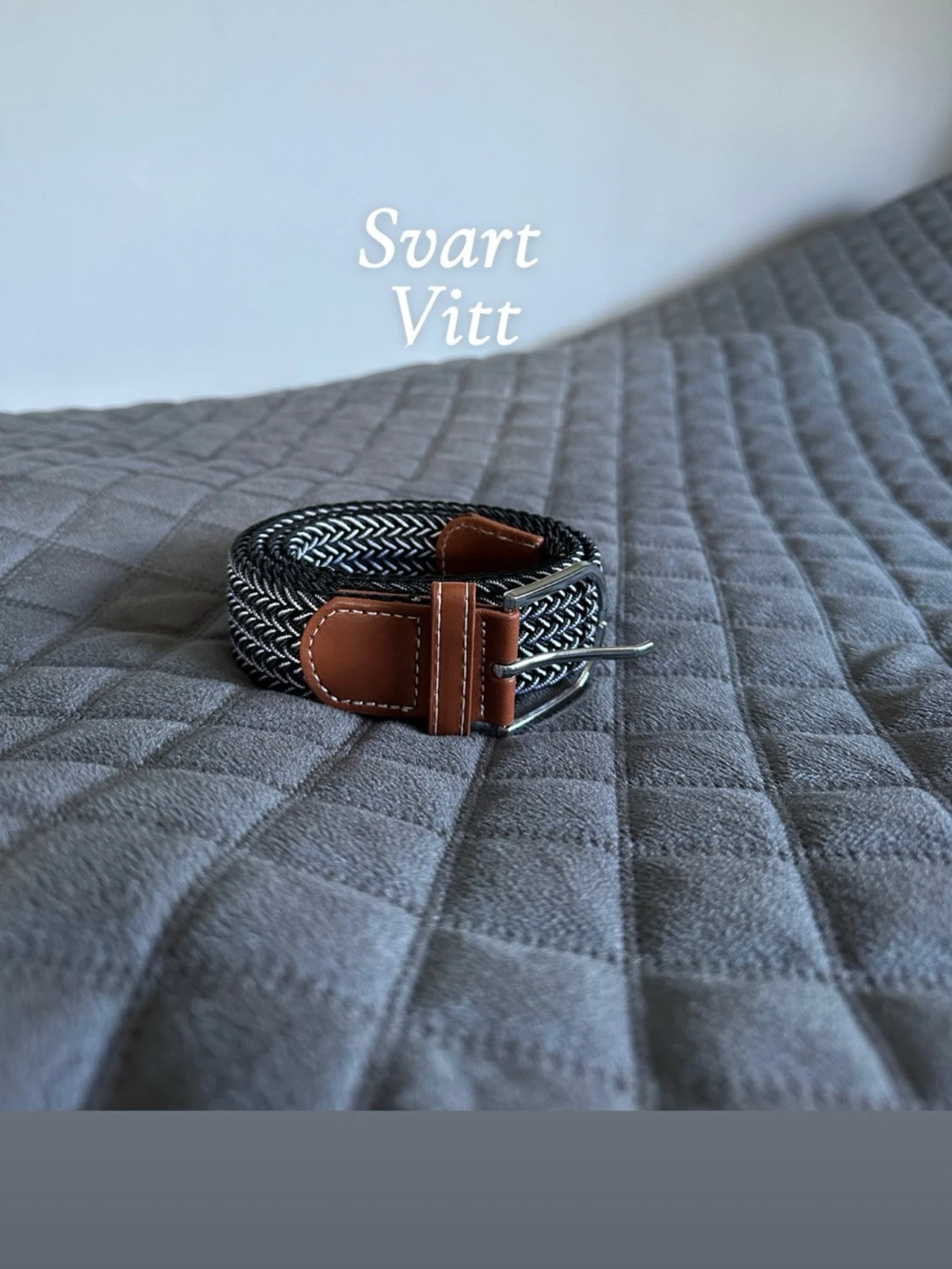 Svart vit flätat bälte