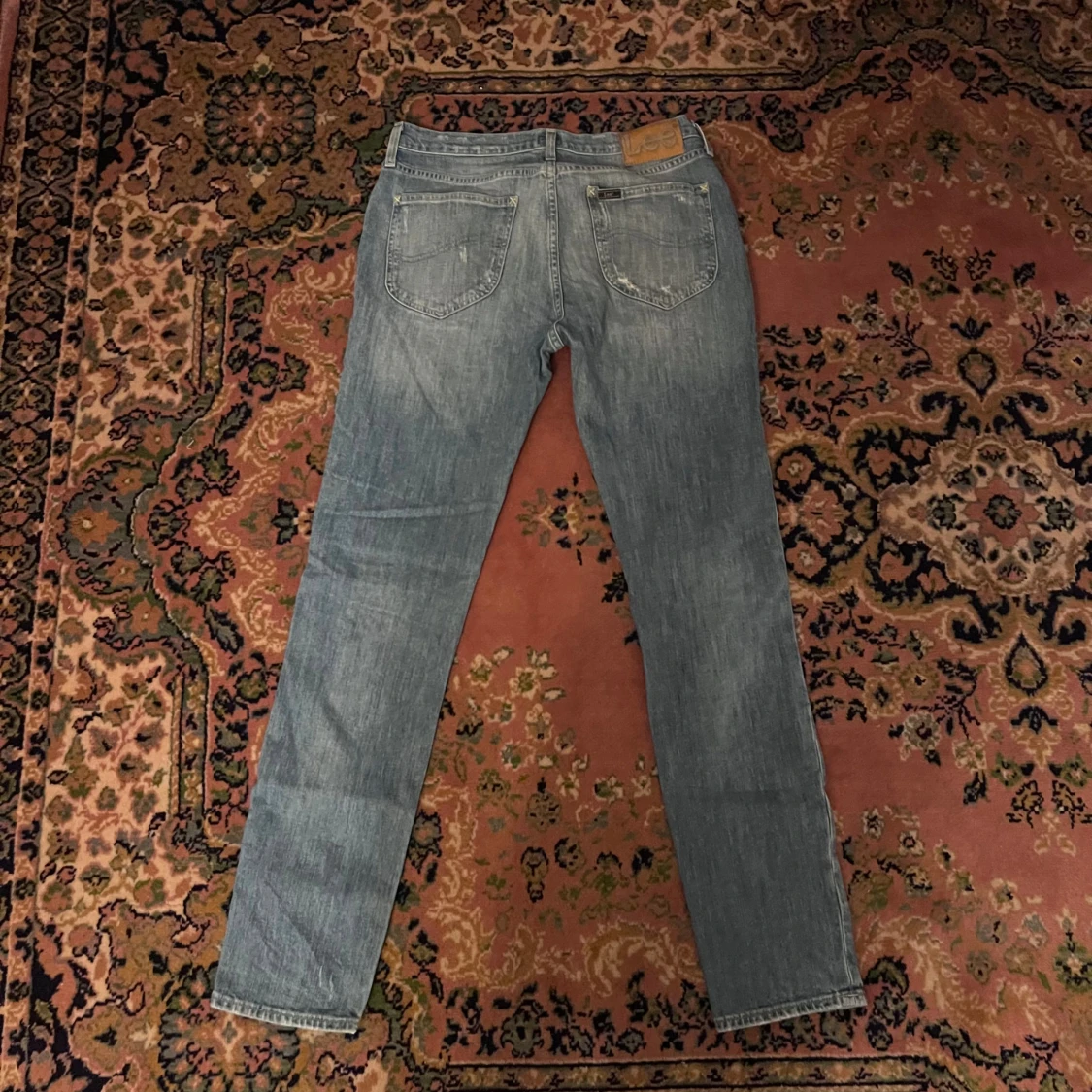 Ljusblå slitna jeans från Lee 30/32 - 2