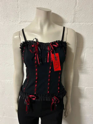 Linne fr Poizen stl M/L - Helt nytt linne från Poizen. Storlek M/L. Material i stretchig bomullstrikå.