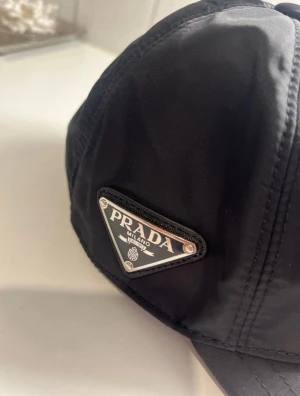 Prada Re-Nylon Keps - Prada Re-Nylon Keps. Strl M.  I nytt skick. 