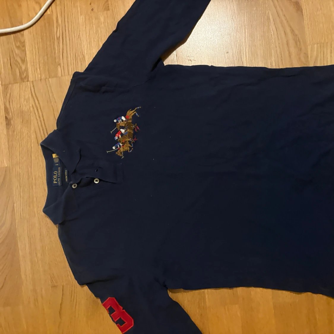 Mörkblå långärmad piké från Ralph Lauren - 1