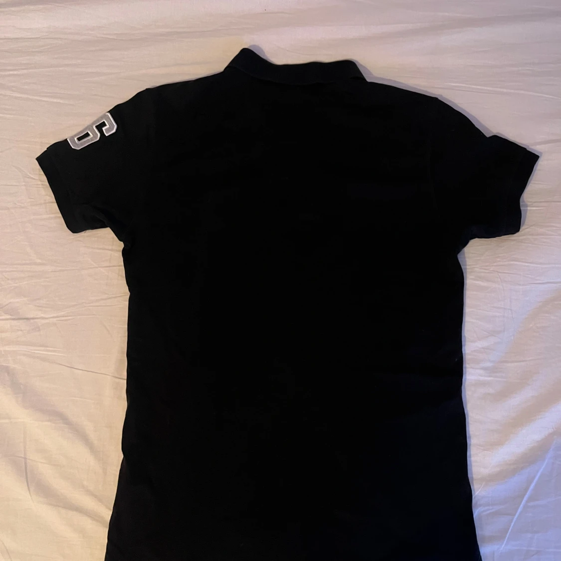 Svart pikétröja Peak Performance - 1