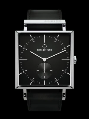 Ny Carl Edmond klocka  - Stilren svart klocka från Edmond med fyrkantigt ur och svart läderarmband. Klockan har en minimalistisk och modern design som passar till många olika stilar. Ronda Quartz Movement. Sapphire Crystal. Svart läderband. Plasrskyddet kvar på glaset. Ny pris: ca 2500kr