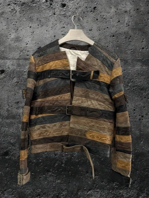 Maison Margiela X H&M belt jacket - Perfect condition with no flaws. The jacket has been extremely well kept and there are truly very few examples available that are even close to this condition. Bag and hanger included. This is one of the most iconic pieces from the Maison Margiela x H&M collaboration. The belt jacket has been worn by the likes of Young Thug and Lil Yachty and is widely recognized as a cult grail in both fashion and music culture. Measurements Length 61 cm Width 51 cm sleeve length 63.5cm