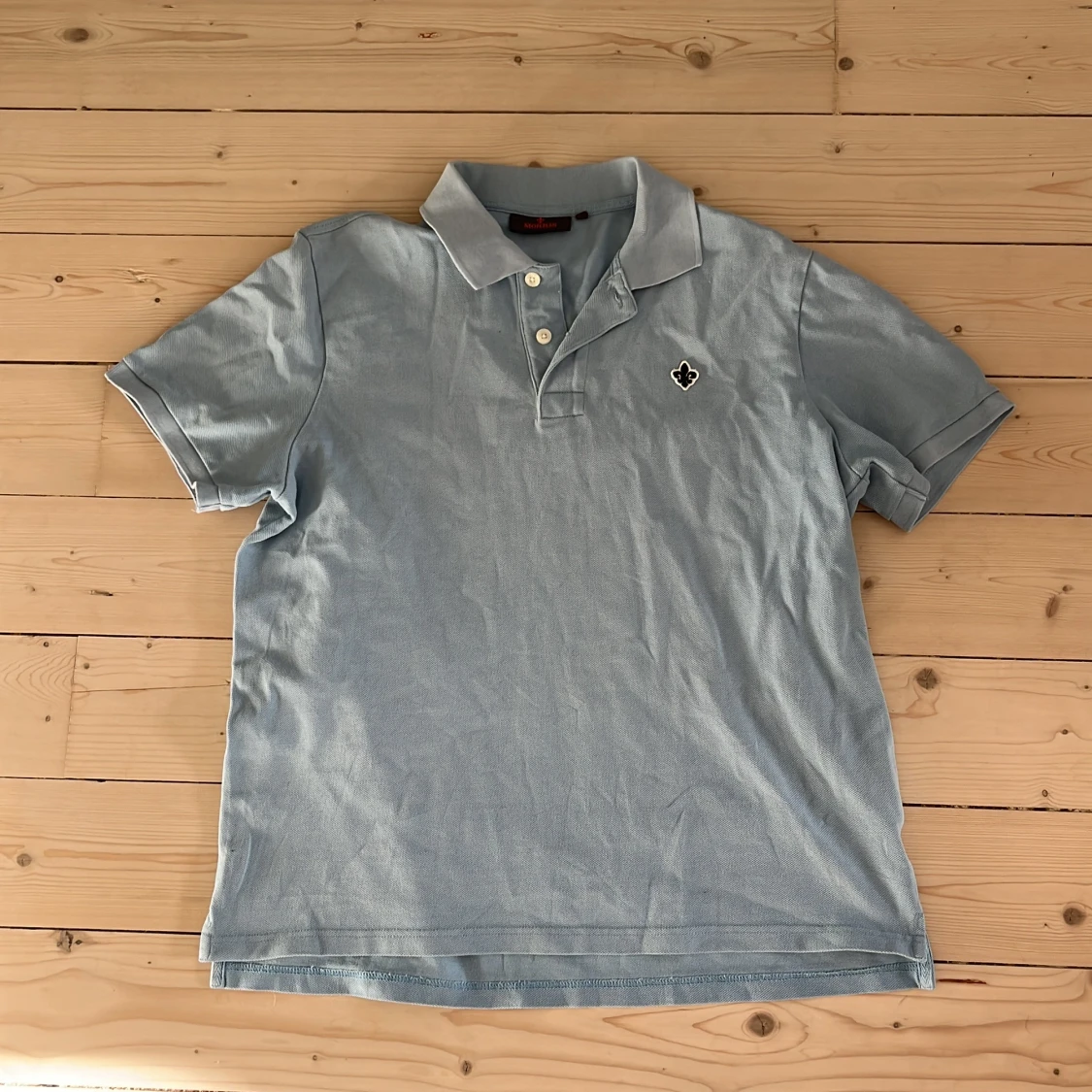 Ljusblå pikétröja från Morris