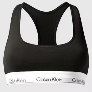 Svart linnetopp från Calvin Klein - Sportig svart linnetopp från Calvin Klein med vit resårkant och logga runt om. Toppen har brottarrygg och är tillverkad i mjukt, stretchigt material som ger en bekväm passform. Perfekt för träning eller chill dagar. Helt ny