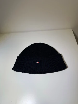Tommy Hilfiger mössa - Mössa från Tommy Hilfiger i nyskick. Skriv pm för prisförslag eller frågor.