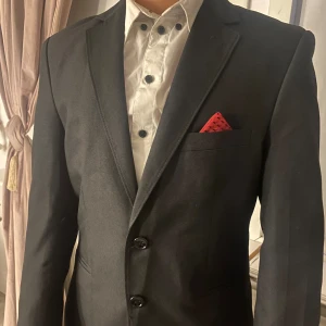 Kavaj - En kavaj med unika detaljer som gör den elegant