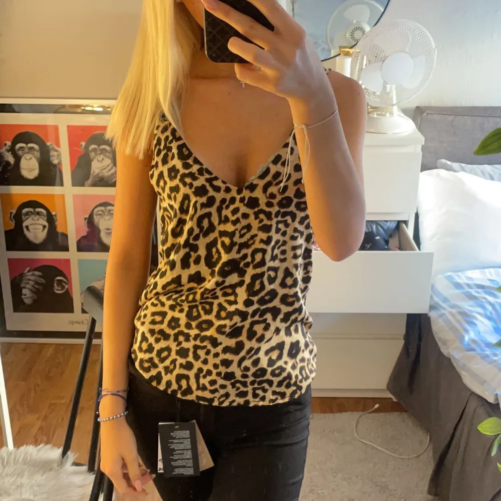 figursytt leopard linne, nyskick. Toppar.