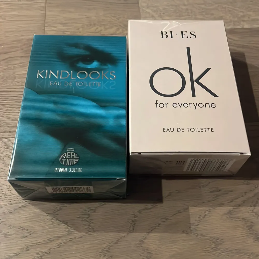 Två Eau de Toilette-parfymer: Kindlooks från Real Time i en turkos förpackning och Bi-es ok for everyone i en vit förpackning. Båda flaskorna innehåller 100 ml doft. Perfekt för den som vill ha en fräsch och mångsidig doft eller att layera med! Är man bara intresserad av den ena går de också bra. PRISET FÖR ANNONSEn AVSER OM MAN VILL KÖPA BÅDA!. Perfume.