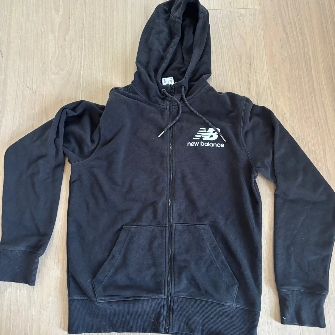 Svart zip up från New Balance S