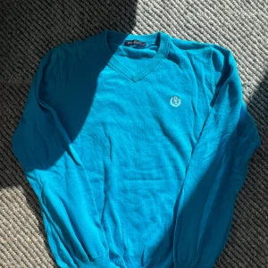 Henri Lloyd tröja - En himmelsblå Henri Lloyd tröja