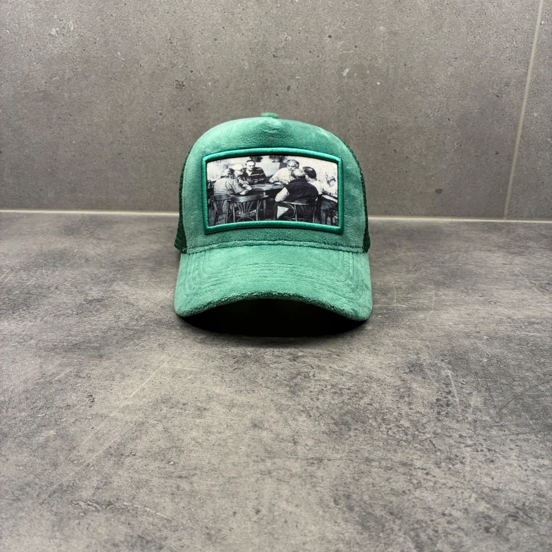 Grön keps Emilio Pendenza 