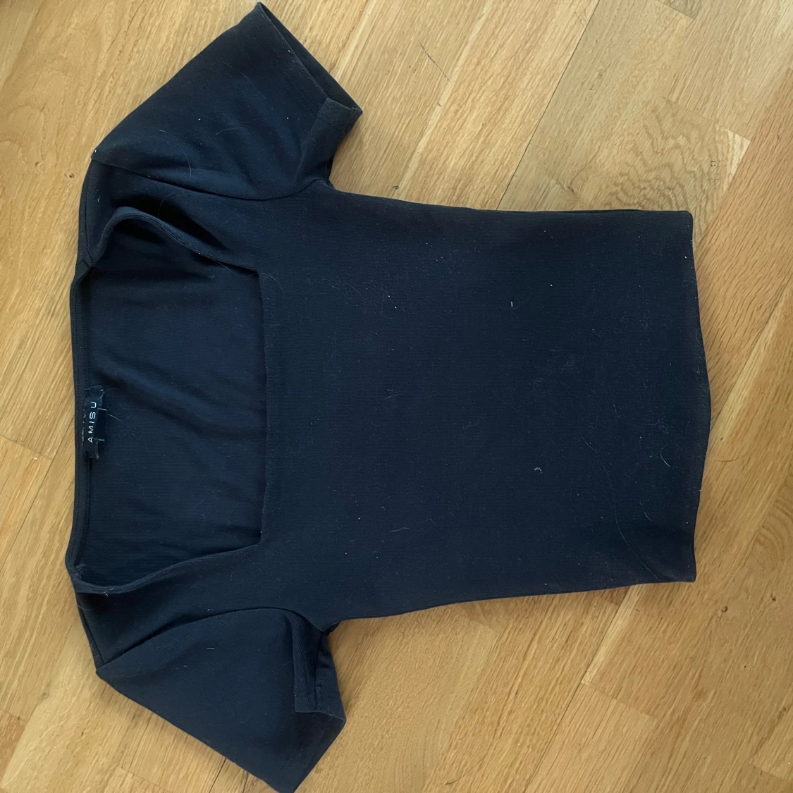 Svart kortärmad topp från Gina Tricot