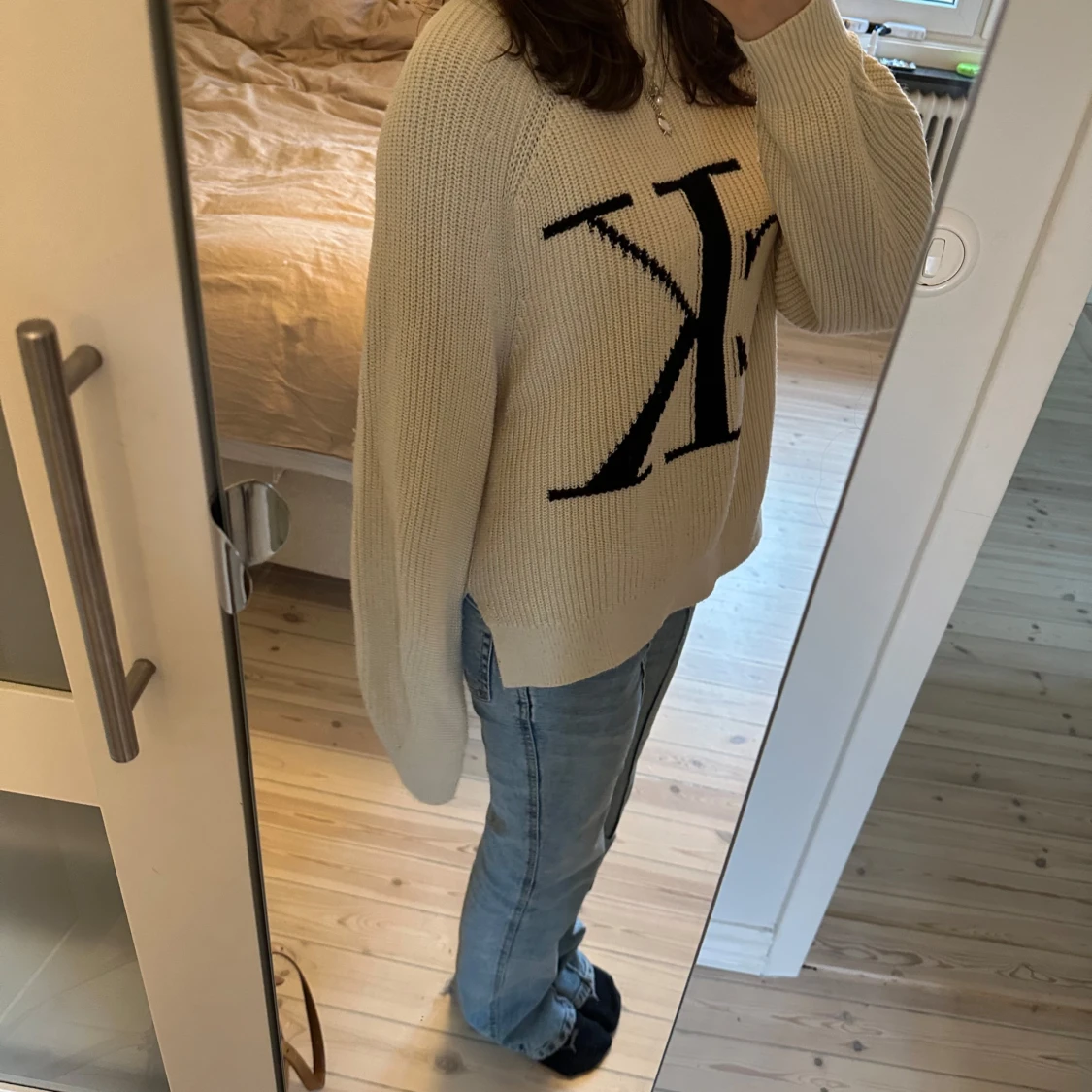 Beige stickad tröja från Calvin Klein - 1