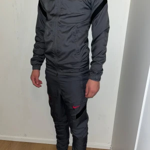 Nike Psg Tracksuit - Grey Psg tracksuit in great condition. Size XS. Original price 140€. There is a small scuff on the trousers but otherwise it is perfect. Ask for more information or pics if needed.