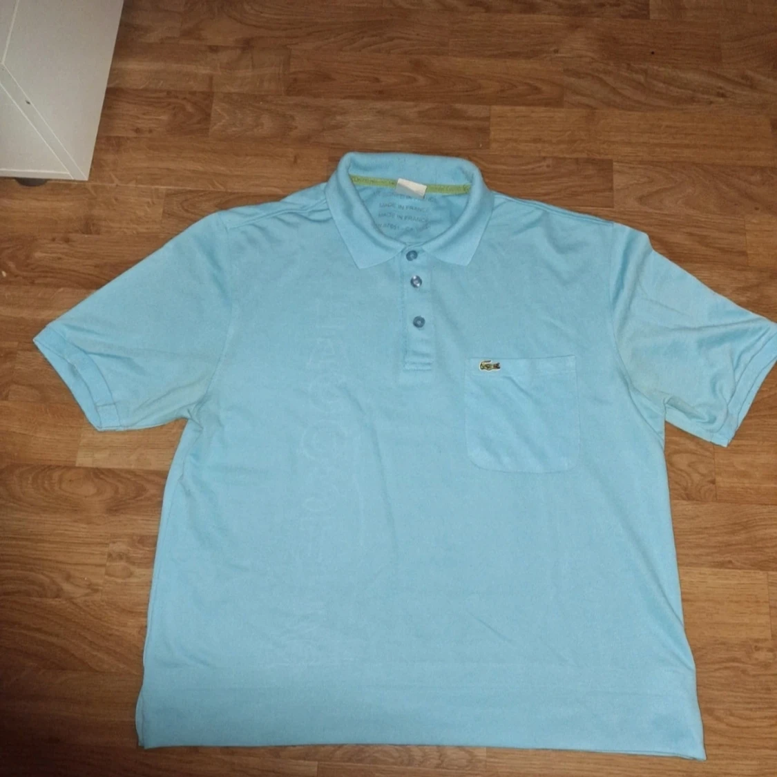 Ljusblå pikétröja från Lacoste