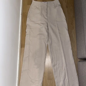 Beiga kostymbyxor  - Oanvända