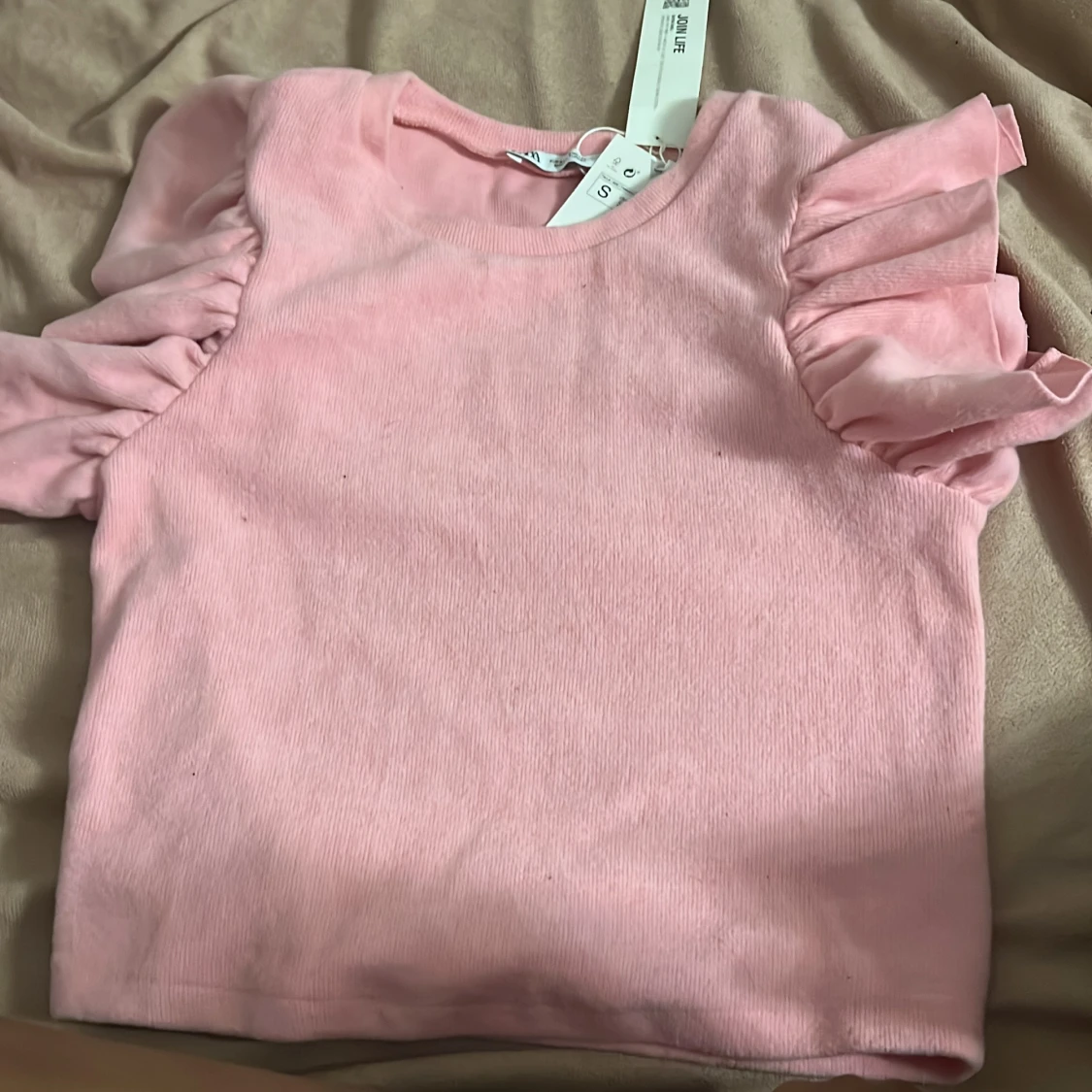 Zara, Rosa topp 