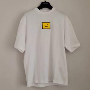Acne Studios tshirt in white with a yellow 