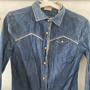 Denim Timberland shirt (small) - Cute Denim Timberland shirt. Size small Smoke and Pet free home. 