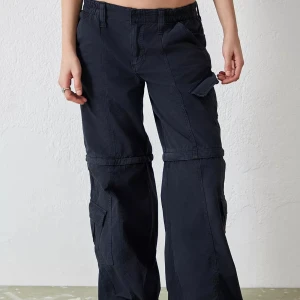 Urban Outfitters - Black zip off Cargos - Black cargos that have a zip off shorts. Barely wore.