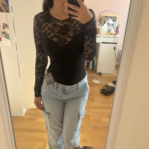 Spelsbody med öppen rygg - Hej säljer denna helt oanvända endast testad bodyn med öppen rygg🌸 den är från Nelly med lappen kvar💕 bodyn är string💓skriv om ni vill ha flera bilder❤️