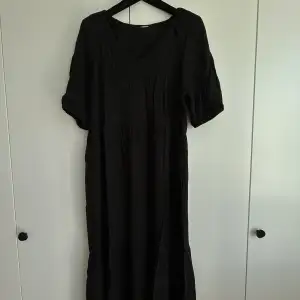 A black summer dress. Loose fitting and so comfortable during summer. 