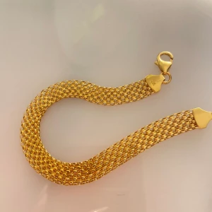 Armband - Jätte fint armband, inte använd alls. 21karat äkta guld mini x länk