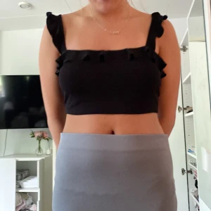 Svart topp - En svart topp från Nelly, den kommer inte till användning 