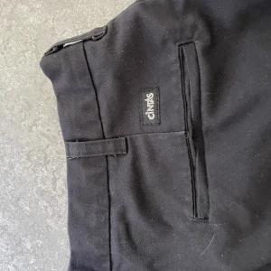 Chinos/komstymbyxor - Chinos/kostymbyxor från Cintas