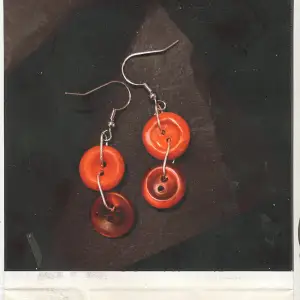 Red button earrings, handmade.  Contact this ad if you want a custom order.  Can make anything!