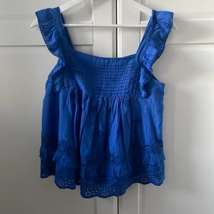 Mango topp - En fin blå mango topp , tyvärr för liten i brösten sä måste sälja, nypris 349