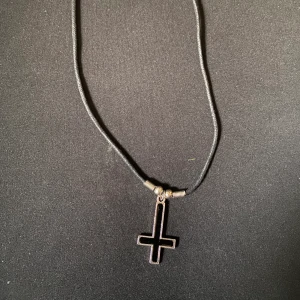 upside down cross necklace  - from my one and only emo era 🤘 selling it since i’m not using it anymore