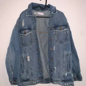 Oversized Zara jean jacket with rips. Worn once, in excellent condition. Size Small but fits medium as well. 