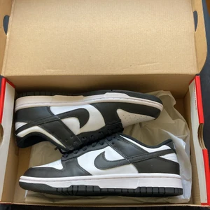 Nike panda dunk low  - A brand new pair of panda dunks in size 39w. Comes with original box and receipt. Condition 10/10 with no flaws. Dm me if you have any questions.  