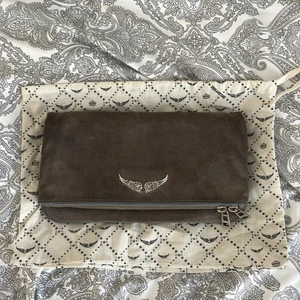 Zadig Voltaire Rock Clutch Bag - Zadig Voltaire Rock Clutch in gray suede and silver metal details. Bought in 2018 used several times but still in very good condition. Two straps one long and one shorter. 4 different compartments. Comes with dustbag.