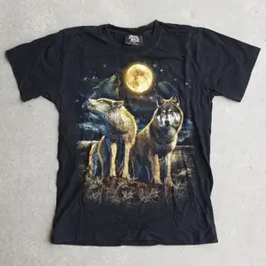 Classic wolf moon print shirt. Glows in the dark, and has super cool print on both sides.