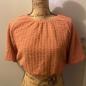 Topp - Rosa mag topp med resor på magen Använd en gång