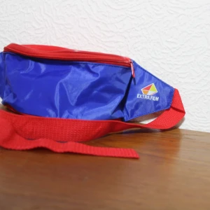 Magväska extrafilm - Världens bästa reklam-magväska är här! EXTRAFILM! nyskick och jävligt söt! Frakt 40kr 