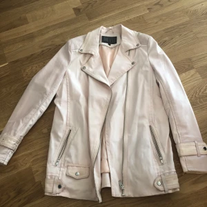 Ljusrosa kappa - Härlig ljusrosa kalla som är väldigt bekväm