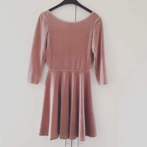 Velvet beige/pinky dress from American Apparel, it's a large but AA sizes are tiny so I'd say it fits a medium or even a small. Never used! 