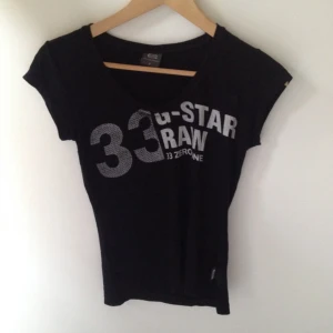  - Black T-shirt with white print 