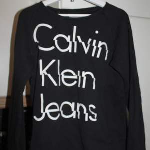 Calvin Klein. Alright condition. As you see - the logo is a little bit cracked.