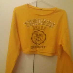  - En gul magtröja köpt på H&M :)