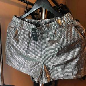 Stretchable silver shorts from Bikbok New with tag! Color: Silver 