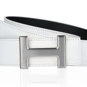 Vitt och Silver H bälte  - helt nytt, allt i bilden ingår, en hålslagare och armband ingår, frakter inom 24 timmar.